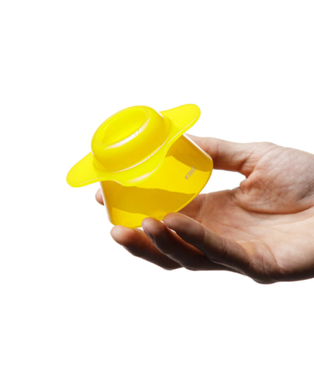 Hand holding a yellow silicone cup